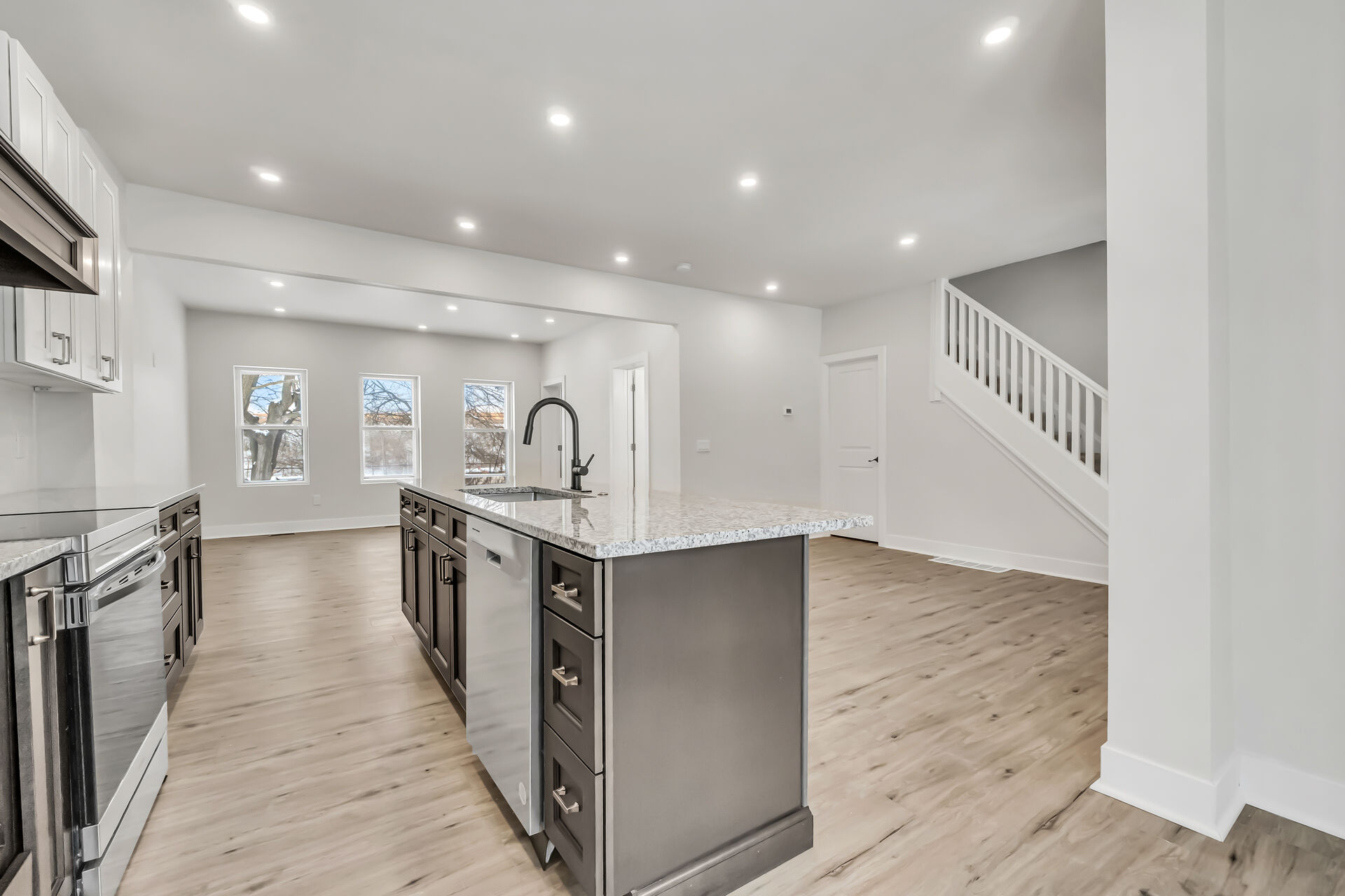 Kitchen with living room in the background